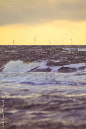 Beautiful view of the coast under storm clouds at sunset in Denmar photo