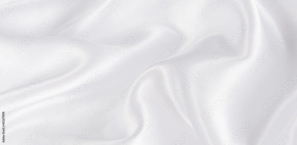 Fototapeta premium abstract smooth elegant white fabric silk texture soft background,flowing satin waves