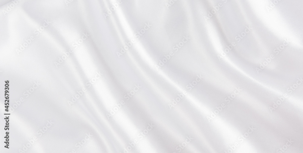 abstract smooth elegant white fabric silk texture soft background,flowing satin waves