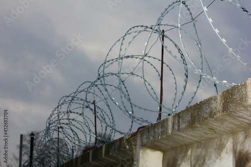 barbed wire against the sky