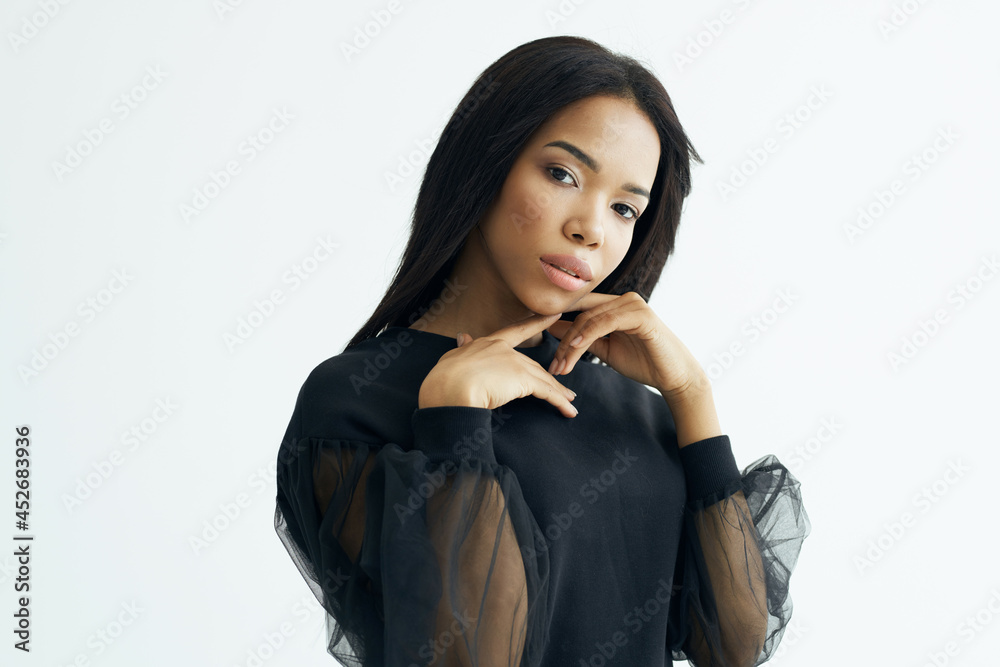 woman of african appearance in black shirt fashionable hairstyle cosmetics glamor woman of african appearance in black shirt fashionable hairstyle cosmetics glamor