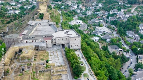 Castle of Gjirokastra and city center. Aerial view of ancient fortress Albania photo