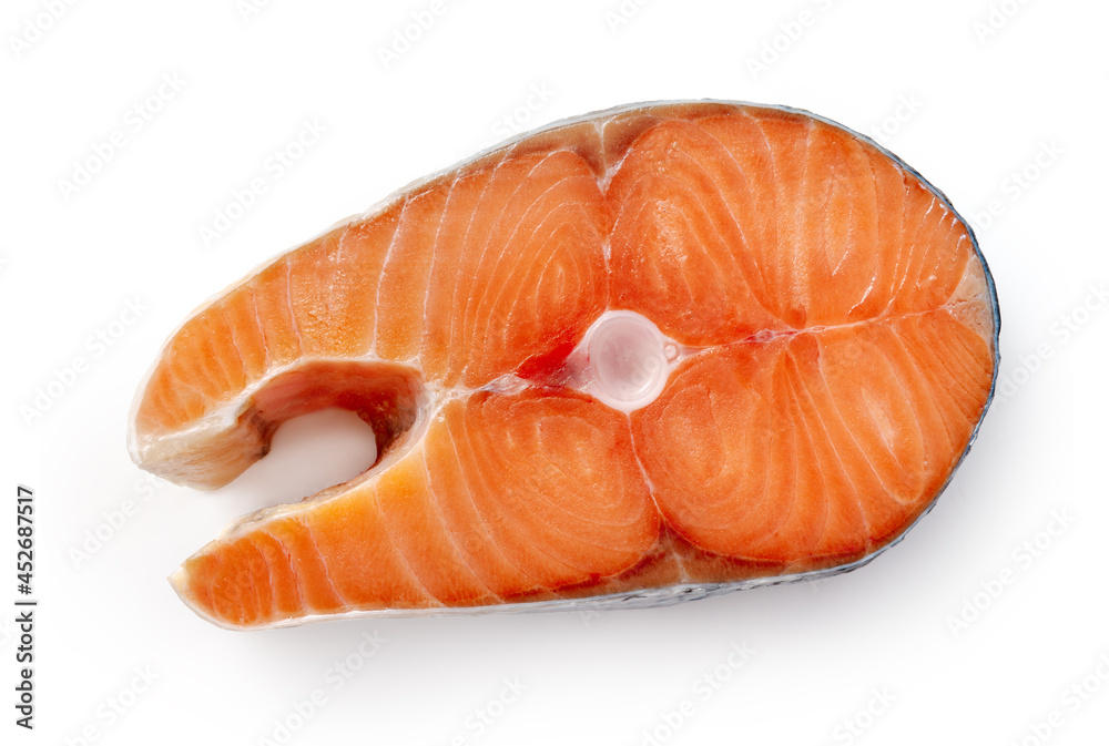 Salmon piece isolated on white background. Top view of salmon steak. Salmon piece isolated on white background. Top view of salmon steak.
