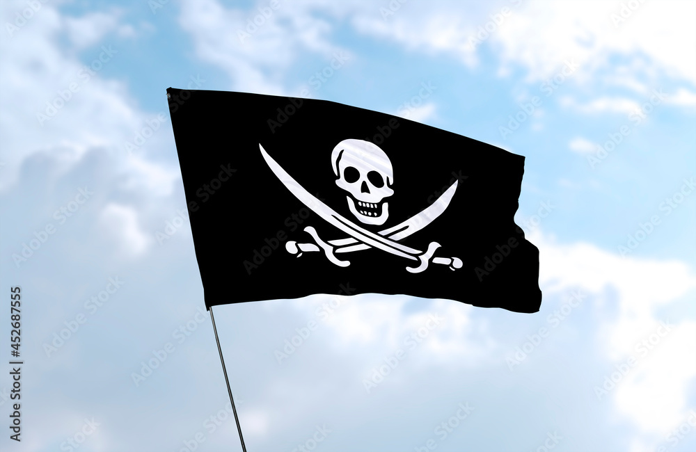 Naklejka premium Pirate Flag, realistic 3d rendering in front of blue sky