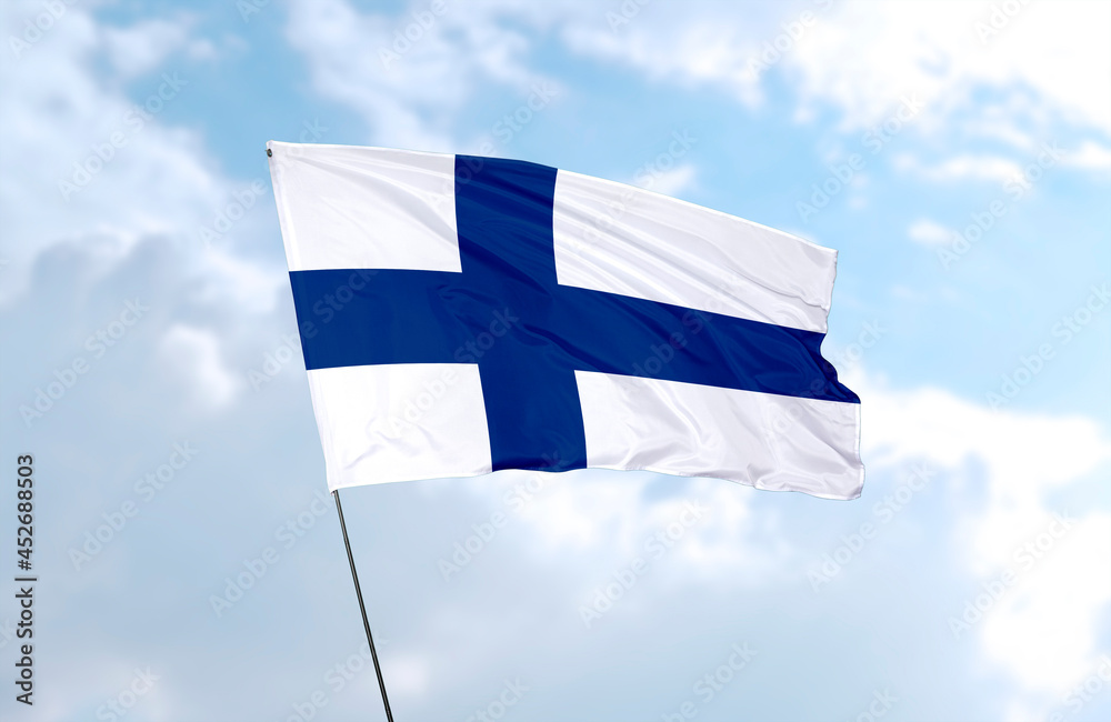 Flag of Finland, realistic 3d rendering in front of blue sky