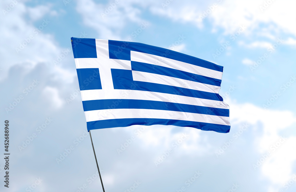 Obraz premium Flag of Greece, realistic 3d rendering in front of blue sky