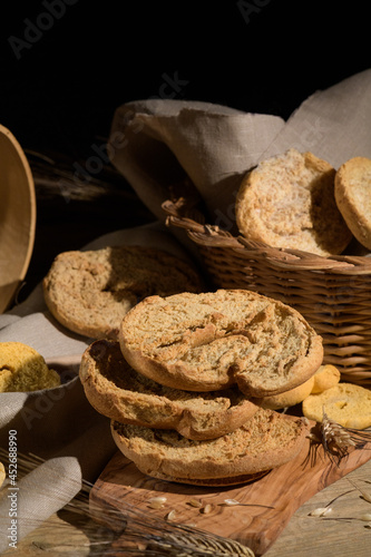 Tipical summer dish of Puglia - friselle. Classical apulian dried bread called freselle. Healthy vegetarian food, close up, selective focus photo