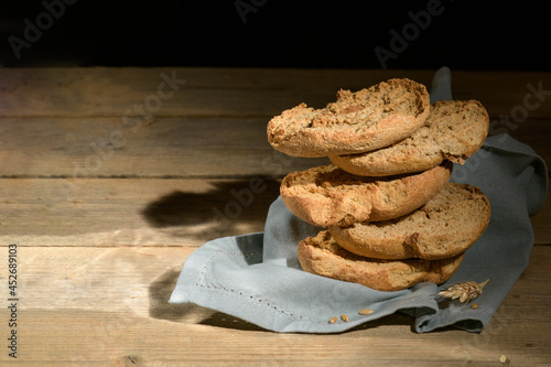 Tipical summer dish of Puglia - friselle. Classical apulian dried bread called freselle. Healthy vegetarian food, close up, selective focus, copy space photo