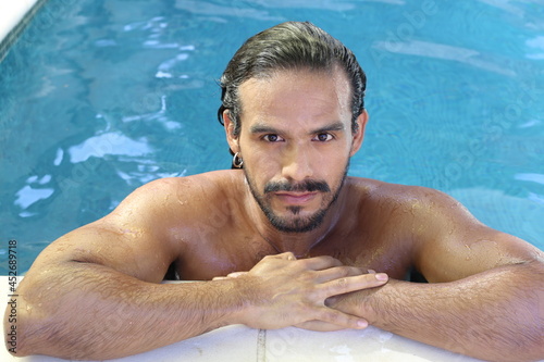 Attractive ethnic man in swimming pool  © ajr_images