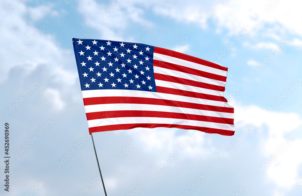 Flag of the United States of America, realistic 3d rendering in front of blue sky