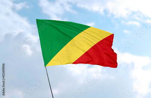 Flag of the Republic of the Congo, realistic 3d rendering in front of blue sky