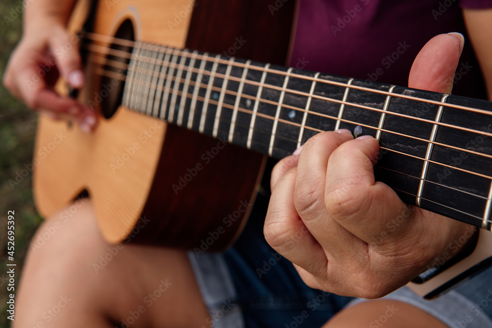 girl playing guitar, learning guitar