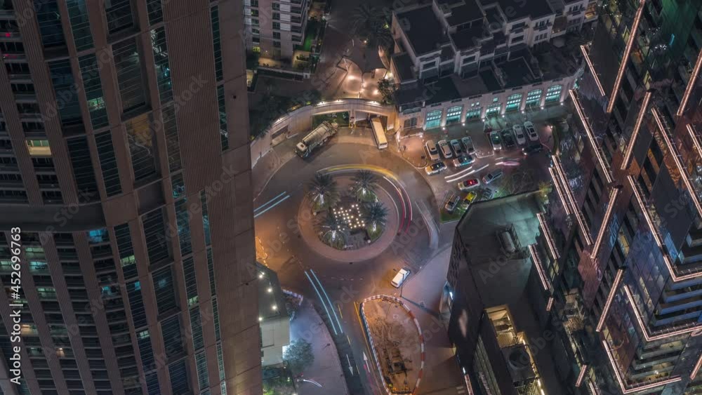 Aerial view of a road intersection between skyscrapers in a big city timelapse. Aerial view of a road intersection between skyscrapers in a big city timelapse.