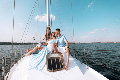 happy family mom dad son sailing on a yacht on a joint weekend. sea vacation. © Mikhaylovskiy 