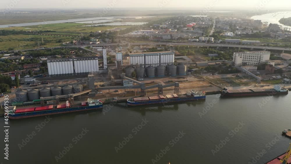 Loading ships with wheat grain for export in the port. Aerial view Loading ships with wheat grain for export in the port. Aerial view