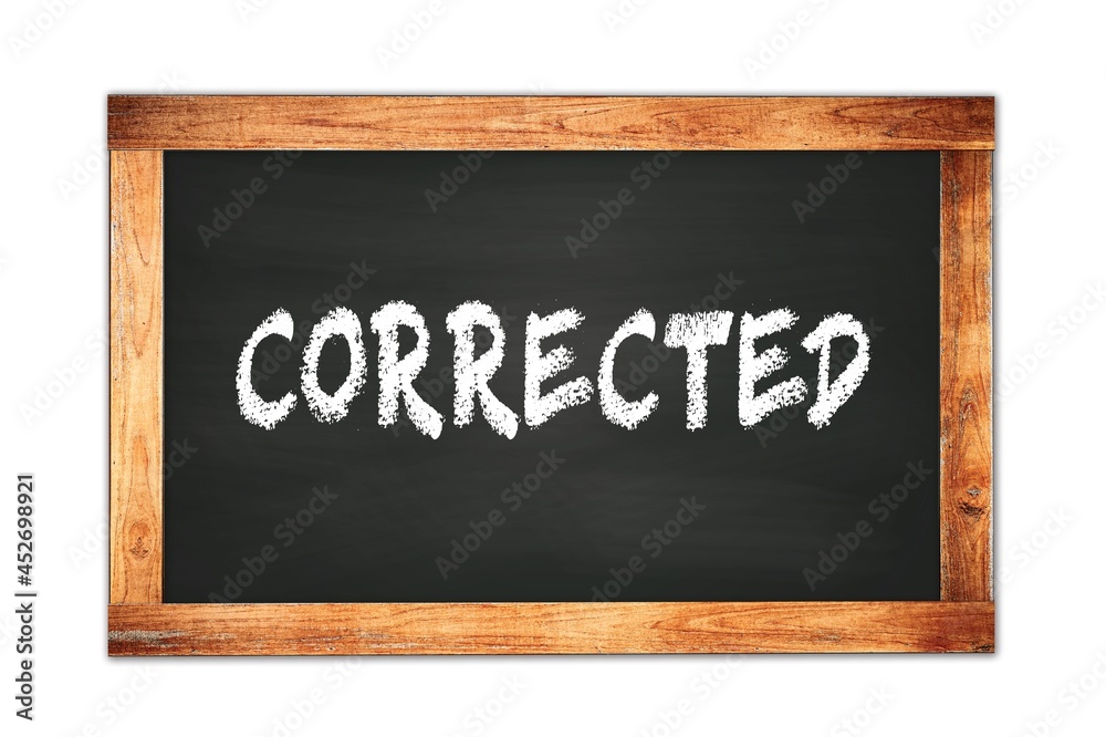 CORRECTED text written on wooden frame school blackboard. CORRECTED text written on wooden frame school blackboard.