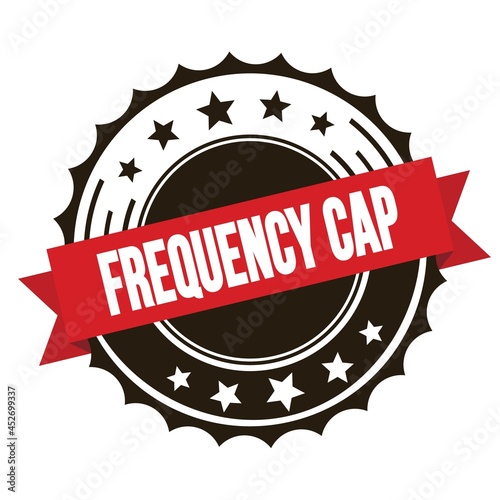 FREQUENCY CAP text on red brown ribbon stamp.