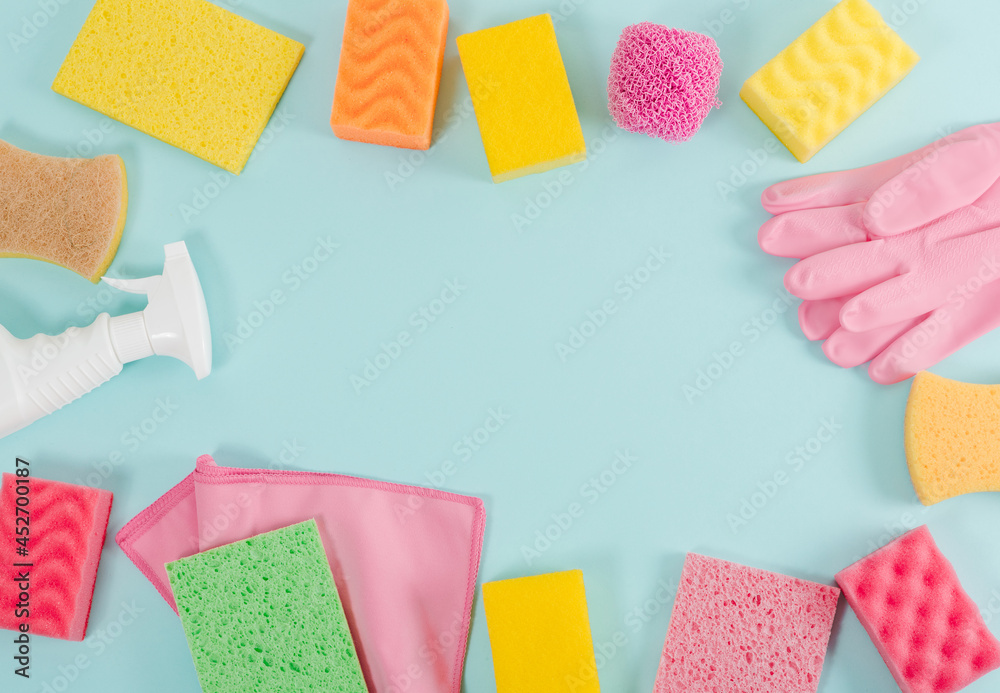 Detergents, accessories for cleaning and cleanliness. Blue background, top view.