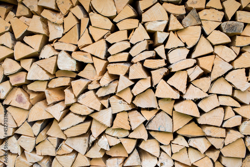 Pile of wood forming a wall. Ecology and deforestation problems in nature.