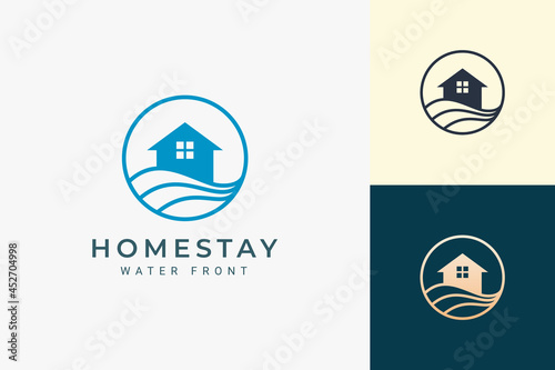 Beach theme residence or apartment logo with ocean wave and circle