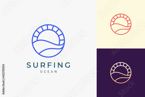 Ocean or water theme logo with waves and sun in circle