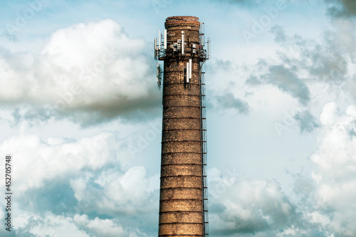 Obraz na płótnie Factory chimney with antennas