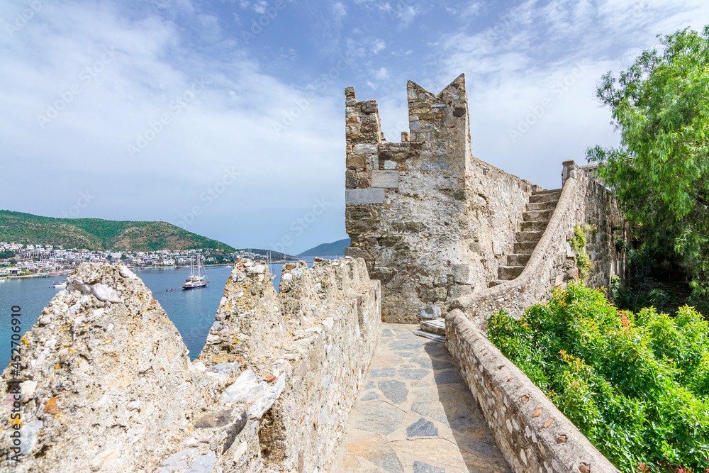 A Tower of Bodrum Castle and Bodrum harbour background, Turkey