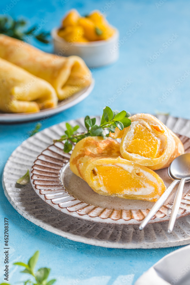 Sticky rice and mango crepe cake roll , .Hong Kong , Thai food style in summer Sticky rice and mango crepe cake roll , .Hong Kong , Thai food style in summer