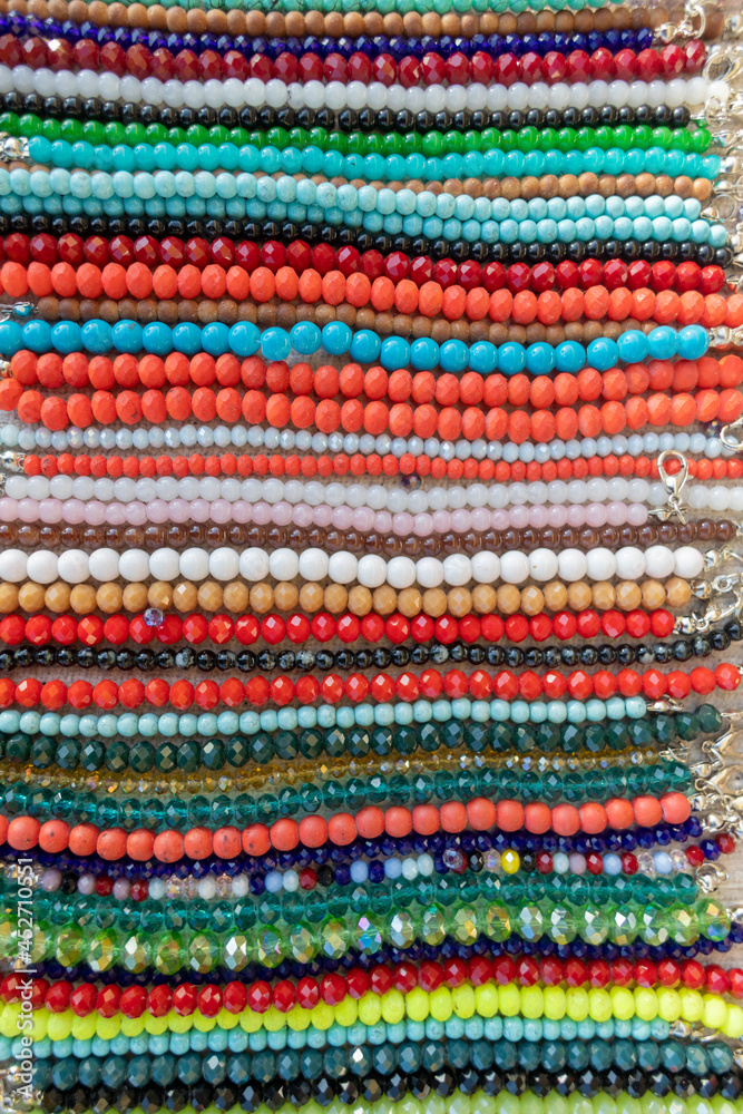 Colorful bead embroidered bracelets. For sale at the counter.