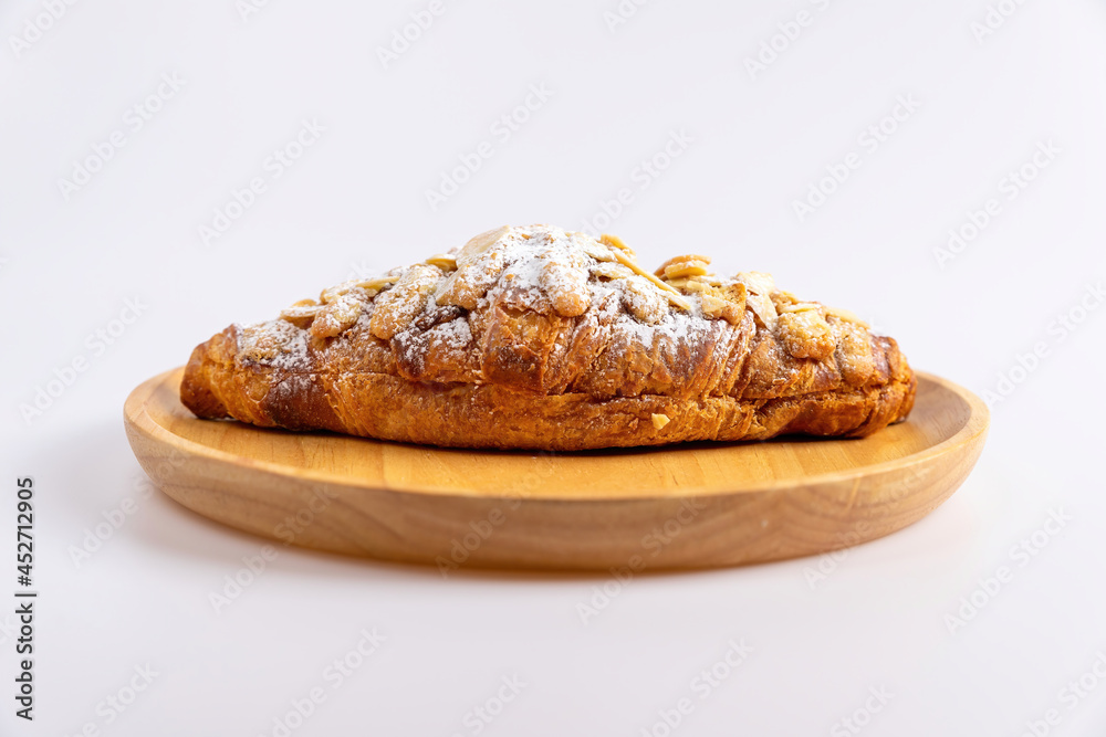 Delicious croissants and coffee cup on wooden plate. Freshly baked. Delicious croissants and coffee cup on wooden plate. Freshly baked.