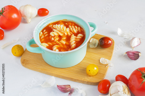 Tomato soup with pasta. Soup in a pot. Homemade tomato soup. Traditional Polish cuisine. Fresh tomato soup.