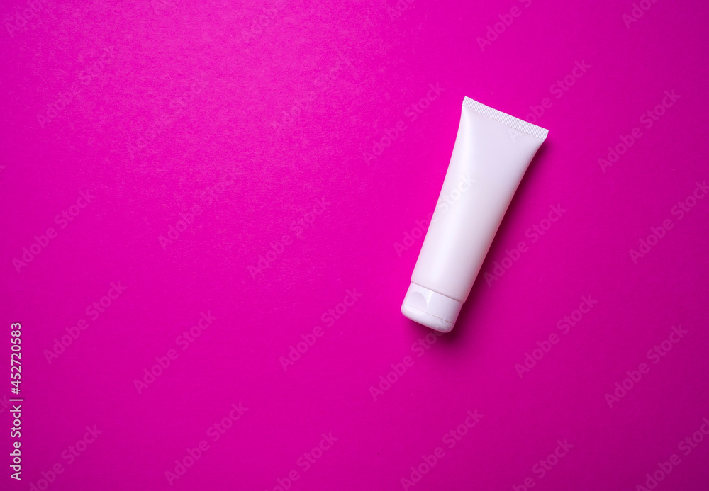packaging of hand or face cream on pink background packaging of hand or face cream on pink background