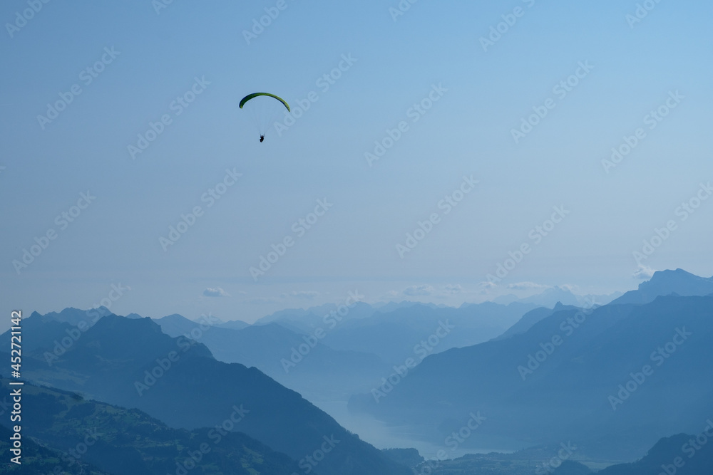 Paraglider in the swiss mountains Paraglider in the swiss mountains