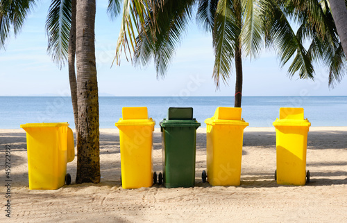 Selective sorting bin on the tropical beach . 