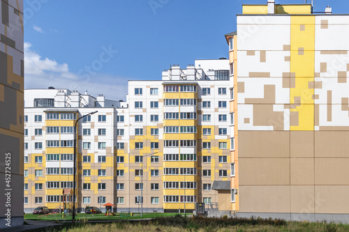 Multi-storey modern residential building. Housing construction. Residential fund. Sleeping residential area. Mortgage loans for young families. © Anoo