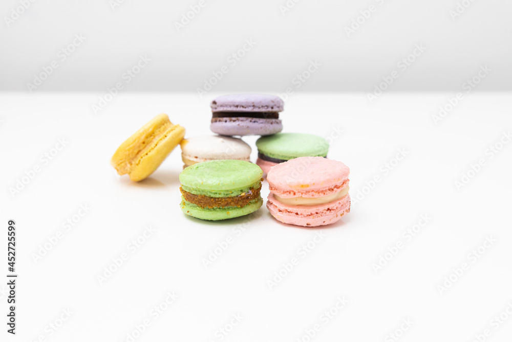 macaroons in different colours on a withe table macaroons in different colours on a withe table