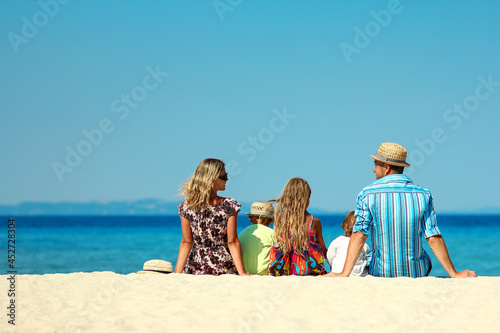 Happy family on the beach on summer