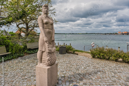 Kerteminde statue of traditional Amanda fishing wonan, Denmark