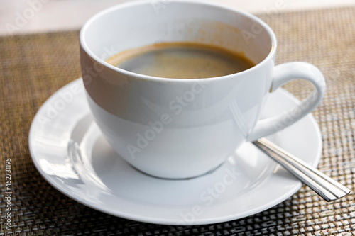 Fototapeta Naklejka Na Ścianę i Meble -  Black coffee crema in white cup on table Laos.
