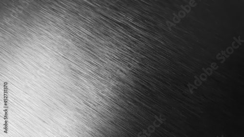 close up metal background abstract with high contrast reflection. brushed hairline iron texture background. stainless or aluminum background.