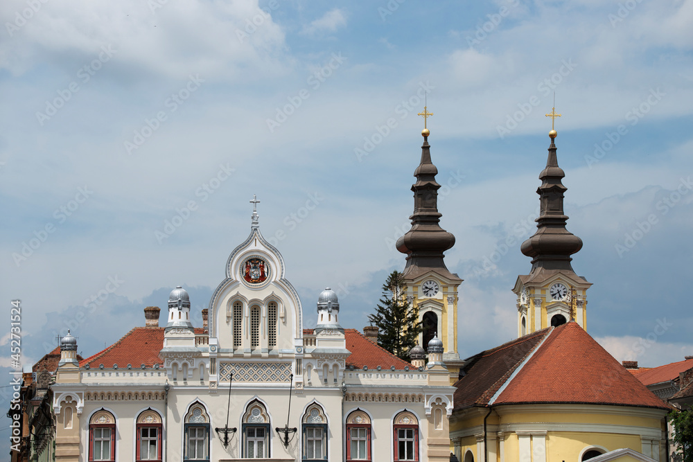 Obraz premium Roofs and upper part of some buildings in Unirii Square in Timisoara in western Romania