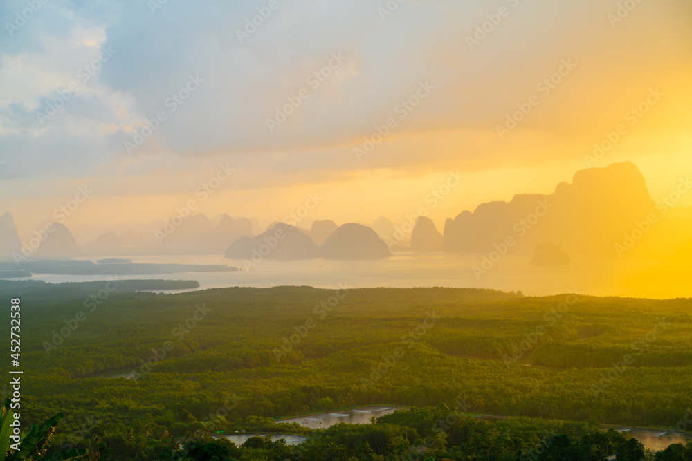Morning sunrise colorful sky with cloud above sea bay forest with island