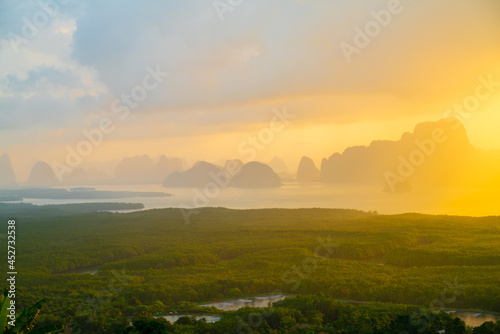 Morning sunrise colorful sky with cloud above sea bay forest with island