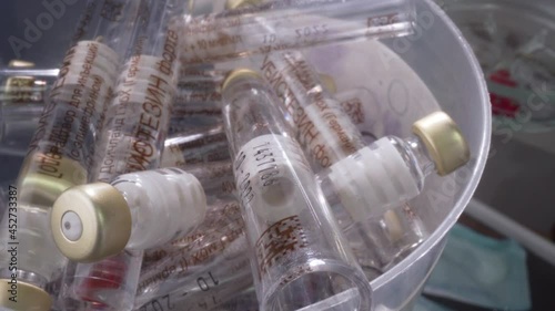 Macro view of empty test tubes in dental clinic. Many test tubes are in a bowl on a spinnign platform. Dental clinic photo