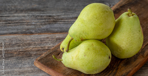 fresh pears on wood background. Copy space photo