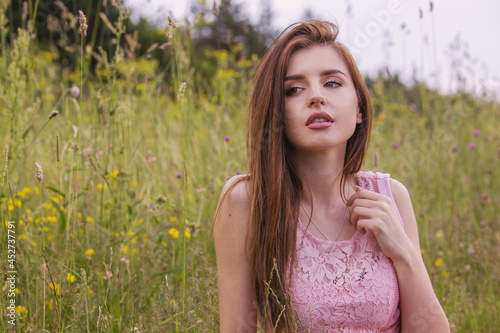 woman with pink dress in nature