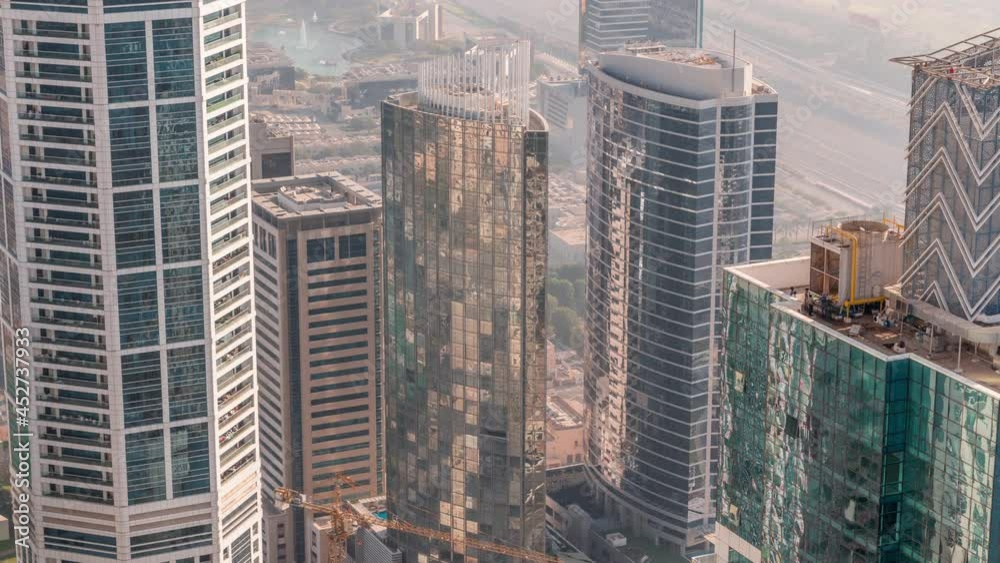 Modern buildings with colorful stained glass windows in Dubai Media City timelapse, United Arab Emirates