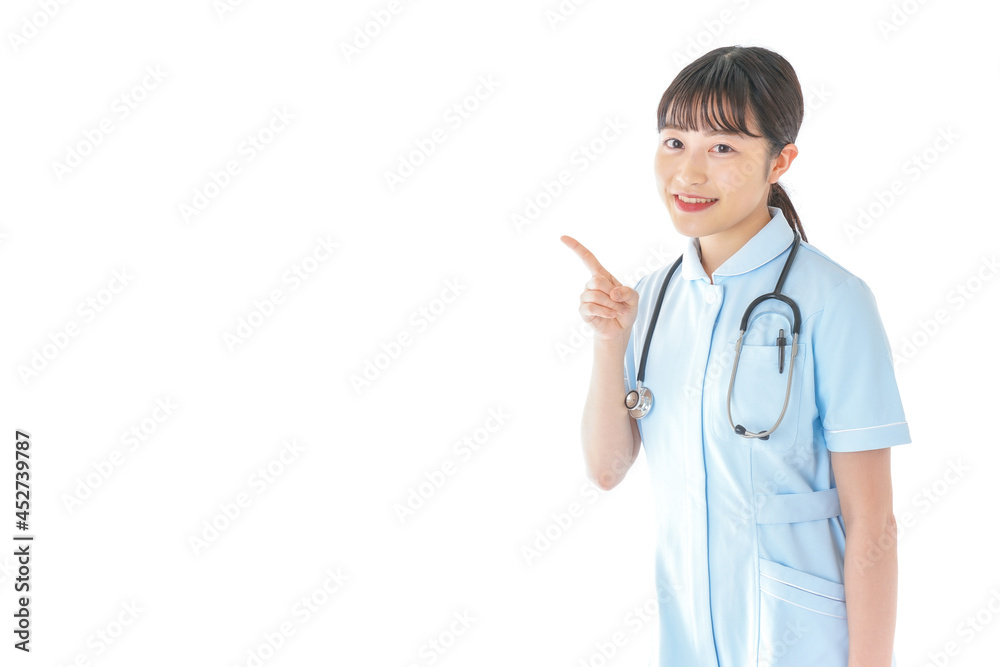 ポイントを指差す若い看護師 ポイントを指差す若い看護師