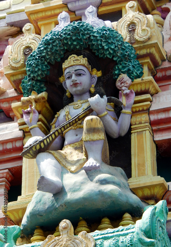 view of Indian Hindu God karthikeya or murugan on the temple tower or gopuram