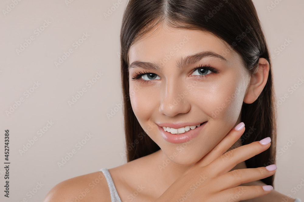 Pretty girl on light background, closeup. Beautiful face with perfect smooth skin Pretty girl on light background, closeup. Beautiful face with perfect smooth skin